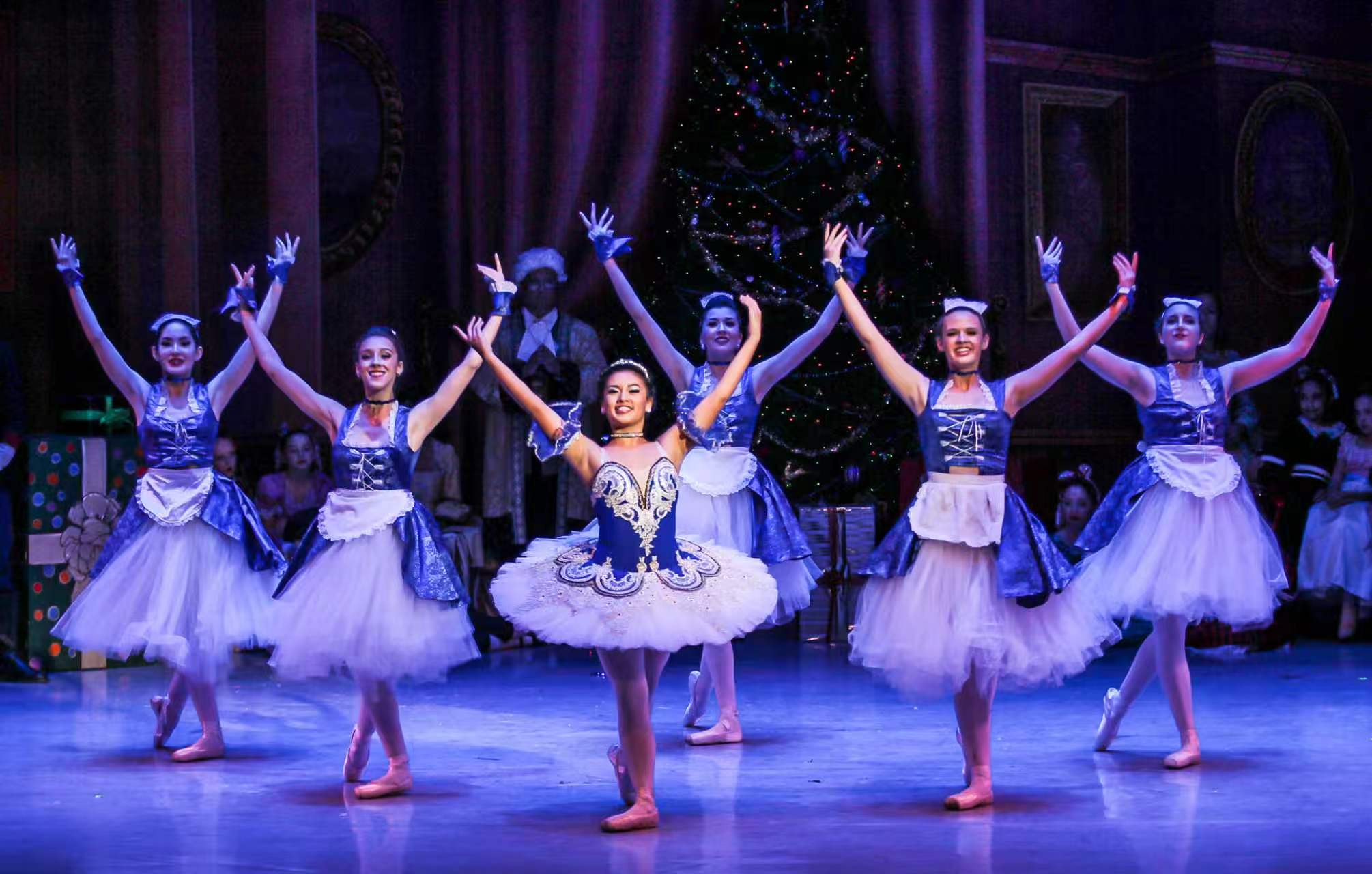 Young ballet dancers performing together on stage